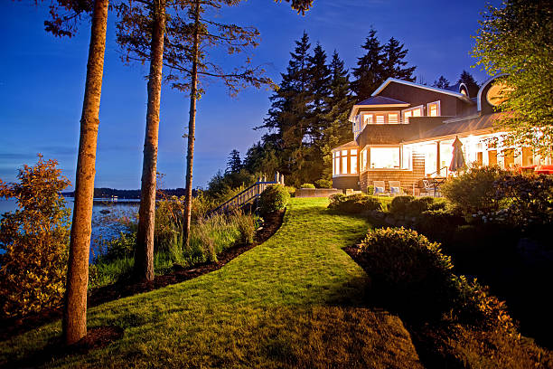 istock Large two story house with lots of lights 545335830