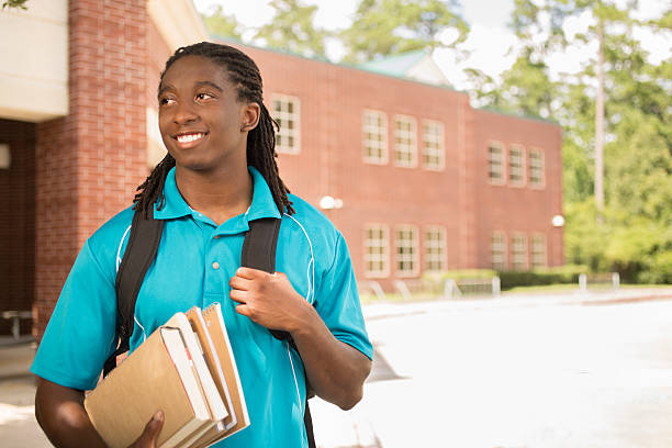 istock African-descent boy on college school campus. 545336128