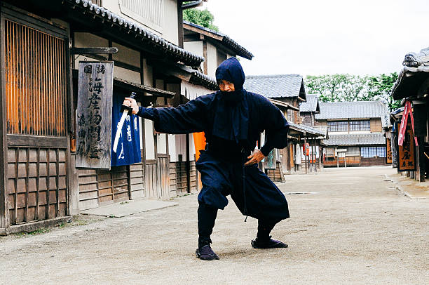 istock Image of ninja in traditional Japanese village 545337576