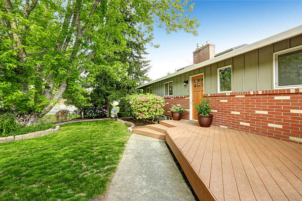 istock American home with patio area, also grass filled lawn. 545338420