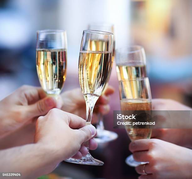 People Holding Glasses Of Champagne Making A Toast Stock Photo - Download Image Now - Adult, Adults Only, Alcohol - Drink