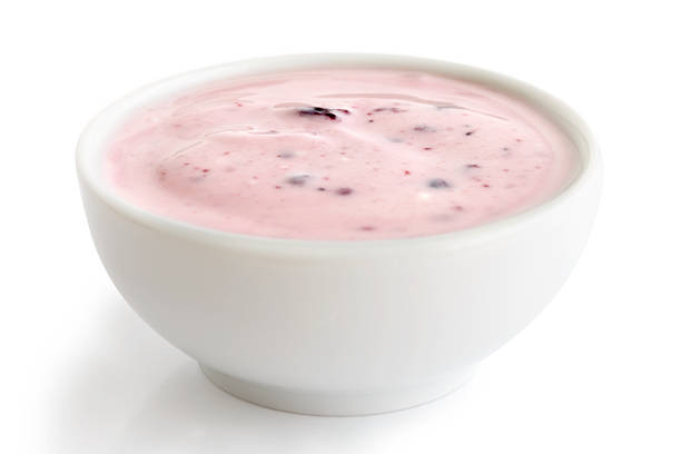istock Ceramic bowl of fruit yoghurt isolated on white background. 545340220