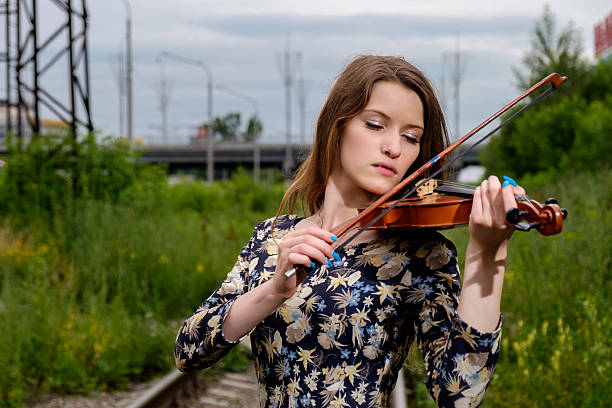 istock Beautiful girl with a violin 545340292