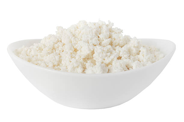 isolated cottage cheese in a bowl stock photo