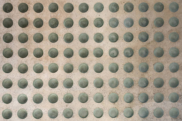istock Concrete floor with round glass inlets 545342738