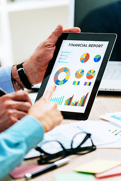 istock Teamwork with two business people in office with business analysis 545344386