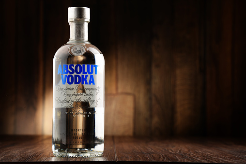 Poznan, Poland - June 22, 2016: Absolut Vodka is a brand of vodka, produced near Ahus, in Sweden. Owned by French group Pernod Ricard it is one of the largest brand of alcoholic spirits in the world.