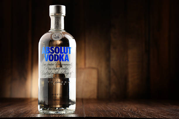 Bottle of Absolut Vodka Poznan, Poland - June 22, 2016: Absolut Vodka is a brand of vodka, produced near Ahus, in Sweden. Owned by French group Pernod Ricard it is one of the largest brand of alcoholic spirits in the world. vodka photos stock pictures, royalty-free photos & images