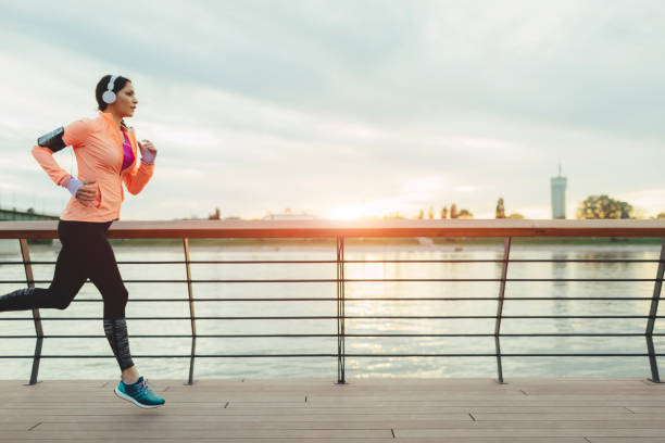 istock Young Woman Jogging Near River. 545346822