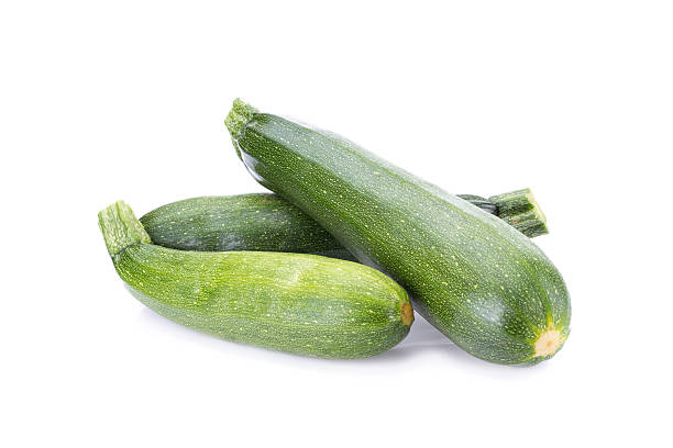 istock green zucchini vegetables isolated on white 545347142