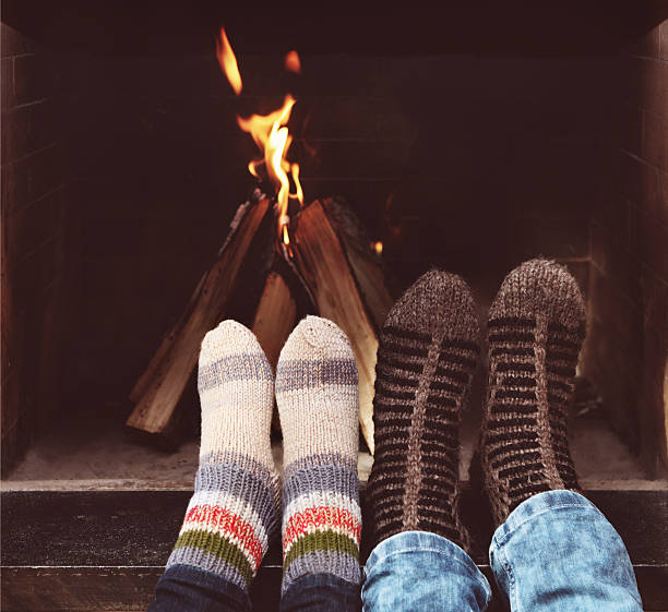 istock Romantic couple in front of fireplace 545347168