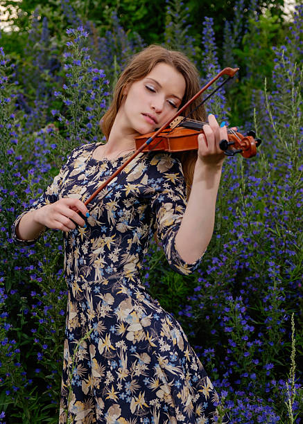 istock Beautiful girl with a violin 545348936