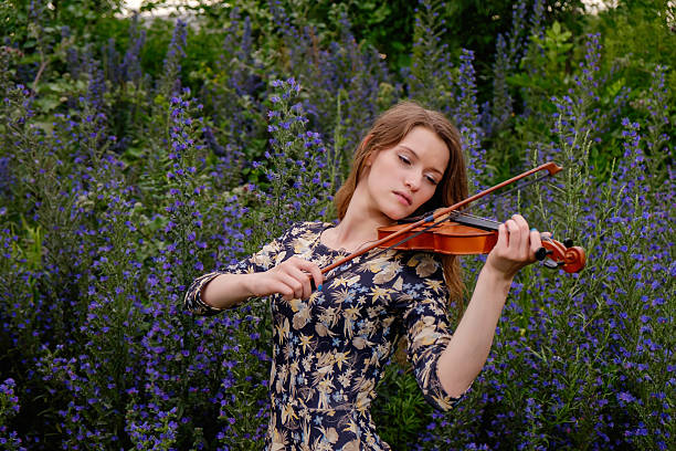 istock Beautiful girl with a violin 545349064
