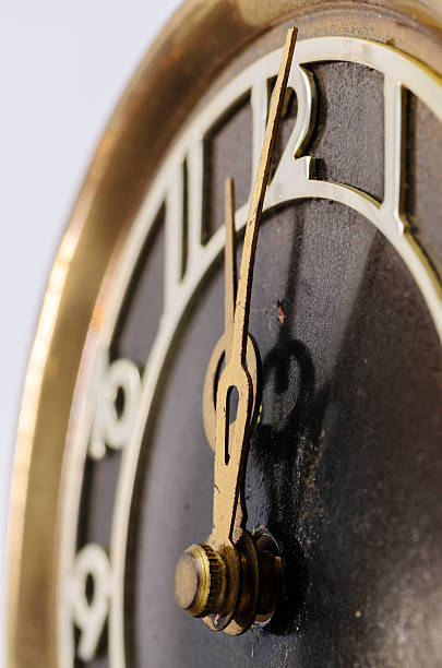 istock Hands old clock on the background of the figure twelve 545349222