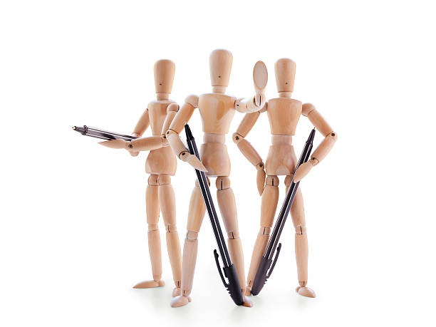 istock Three armed with pens mannequins isolated on white 545354352