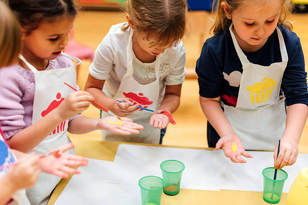 istock Children Painting Their Hands With Watercolors 545354712