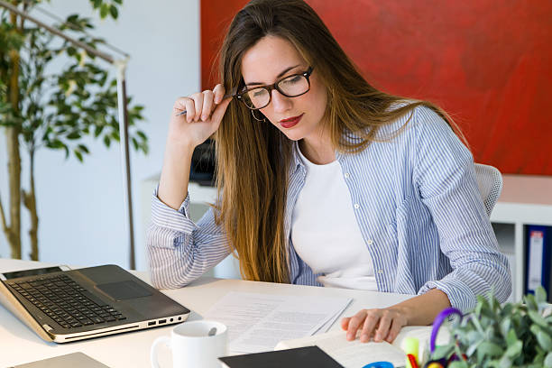 istock Beautiful young woman working with laptop in her office. 545354950