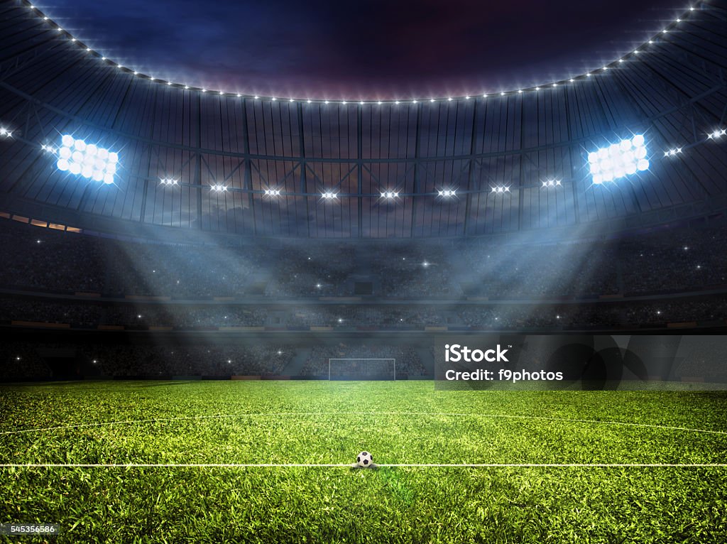 Soccer football stadium with floodlights Sport concept background - soccer footbal stadium with floodlights. Grass football pitch with mark up and soccer goal with net Soccer Field Stock Photo