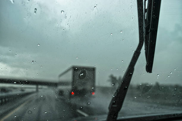 istock Spray from tractor trailer in a heavy rain on highway 545356778