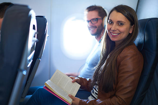 istock young couple in airplane 545357956