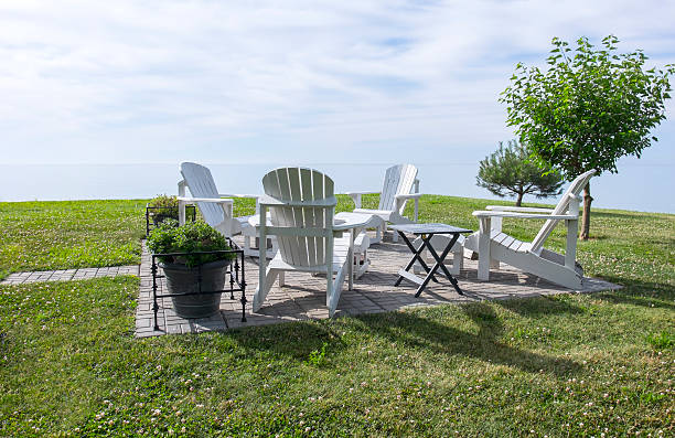 istock White Adirondack Chairs by Lake Erie 545358502