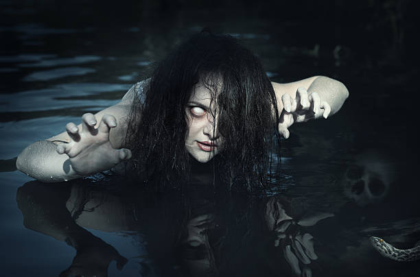 terrible dead ghost woman in the water - halloween horror vampire witch imagens e fotografias de stock