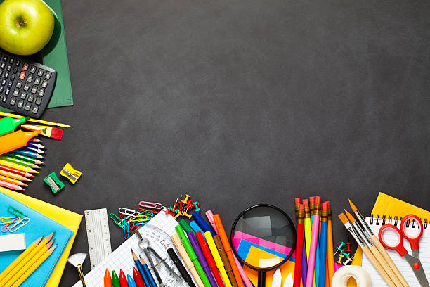 istock Chalkboard with school supplies at the left and bottom borders 545360382
