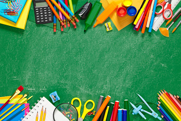 istock Chalkboard with school supplies at the top and bottom borders 545361210