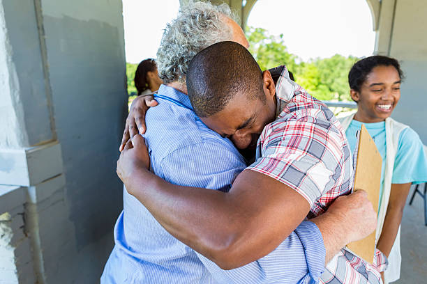 istock Grateful father embracing senior man 545361286