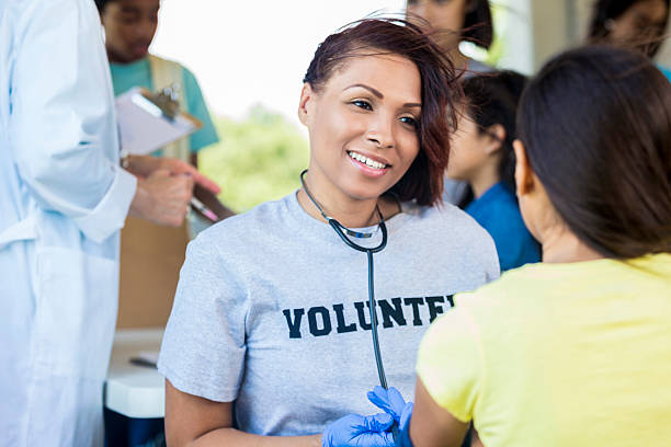 istock Smiling African American volunteering nurse with patient 545365612