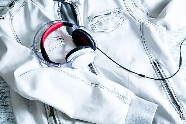 Photo of Headphones on a white Jacket