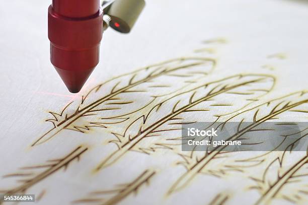Laser Cutting Machine Stock Photo - Download Image Now - Laser, Cutting, Wood - Material