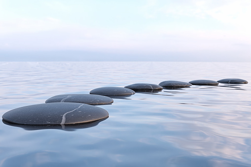 Zen stones in water with reflection - peace meditation relaxation concept
