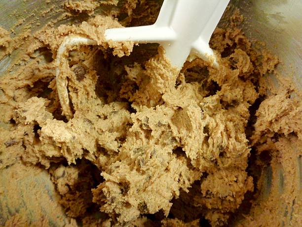 istock Chocolate chip cookie dough in mixing bowl 545368780