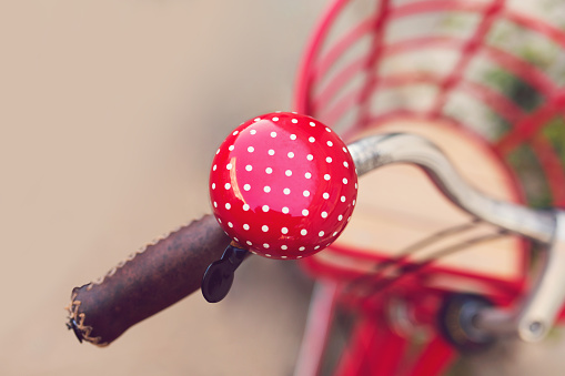 Red bike bell, close-up.