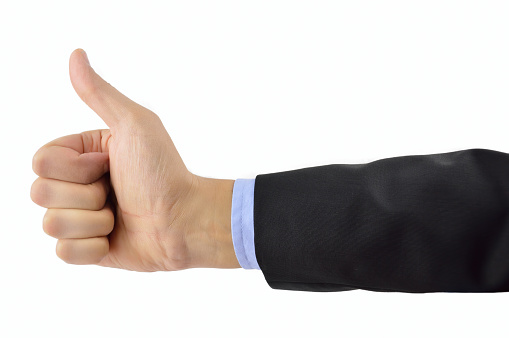 closeup of right hand of a businessman gesture of ok isolated on white background