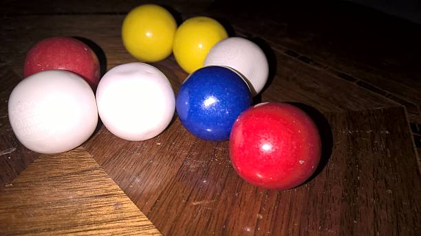 istock Organized Gumballs on wooden table 545373588