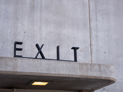 Angled closeup of art deco exit sign at Hoover Dam. Taken June 2016.