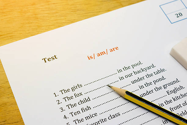 istock english test on brown wooden desk with gradient light 545374148