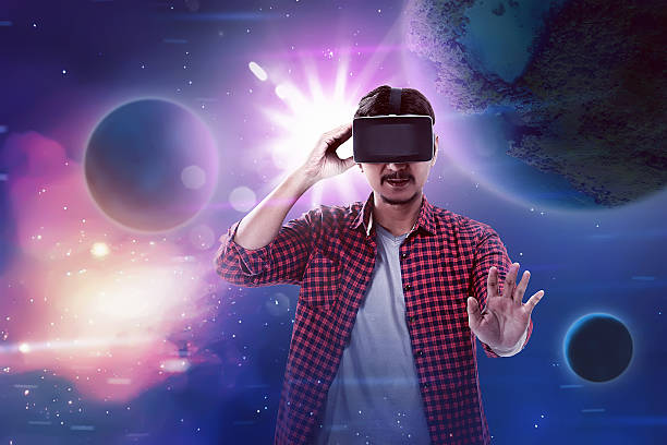 istock Man wear VR headset get into virtual reality world 545374406