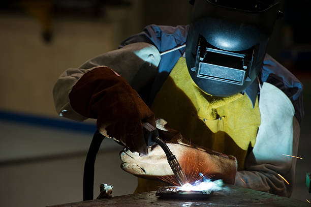 istock Men wear protective clothing welding steel. 545378452