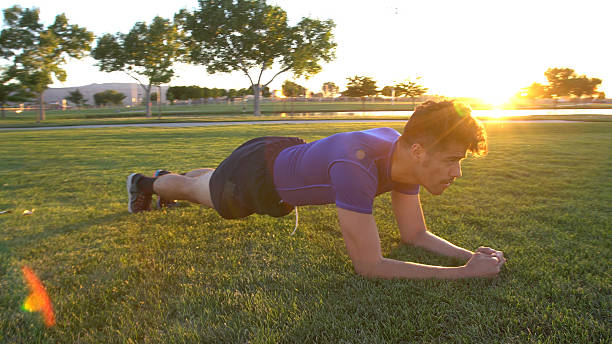 istock Young Athletic Man Exercising In A Park 545379060