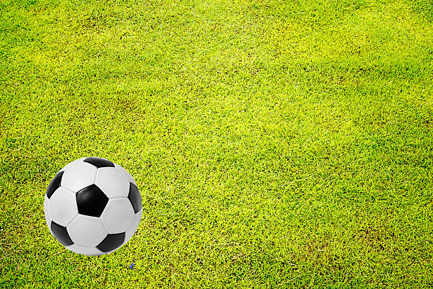 istock Backgrounds  grass  and  football 545420664