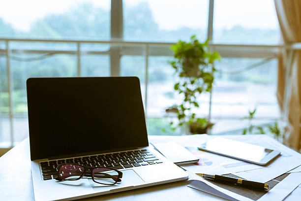 istock laptop and documents and phone in office 545420684