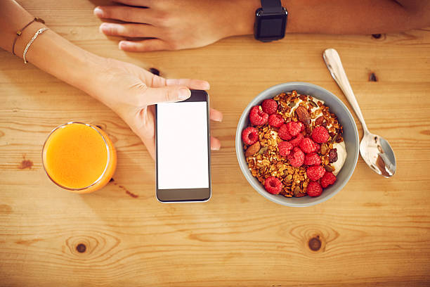 istock Cropped image of woman using smart phone with blank screen 545423346