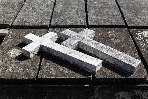 istock Double Concrete Crosses over the Grave 545423598