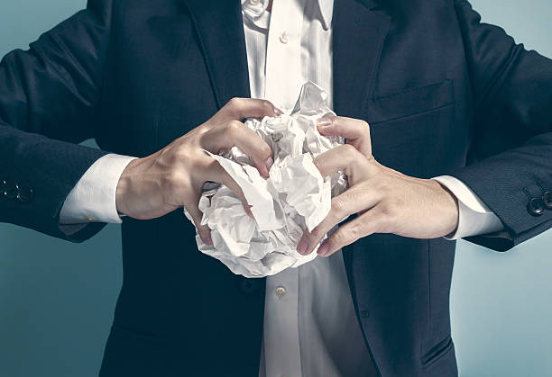 istock Asian businessman holding wastepaper 545423612
