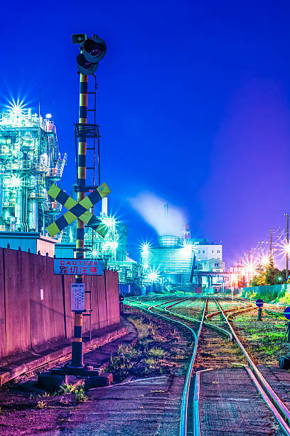 istock Cargo rail tracks in an industrial area at night 545424324