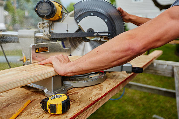 istock Man using saw to cut wood 545424926