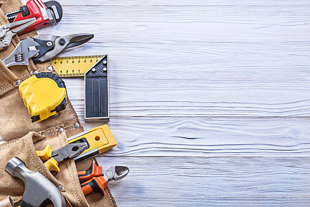 istock Construction tooling in leather toolbelt on wooden board copy sp 545427590